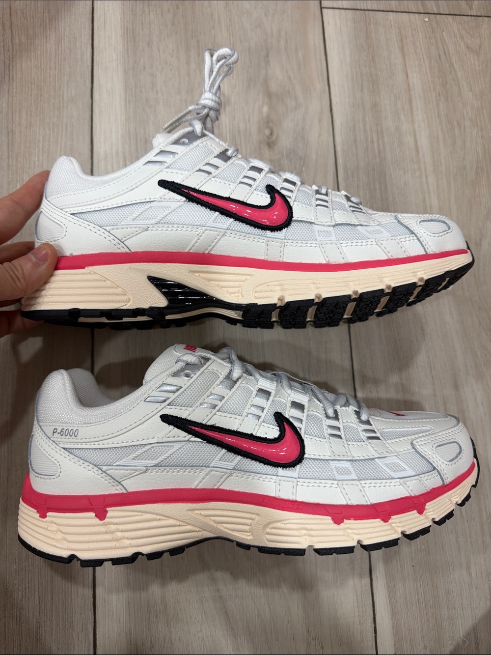Nike White Sneakers with Pink Swoosh and Cream Midsole